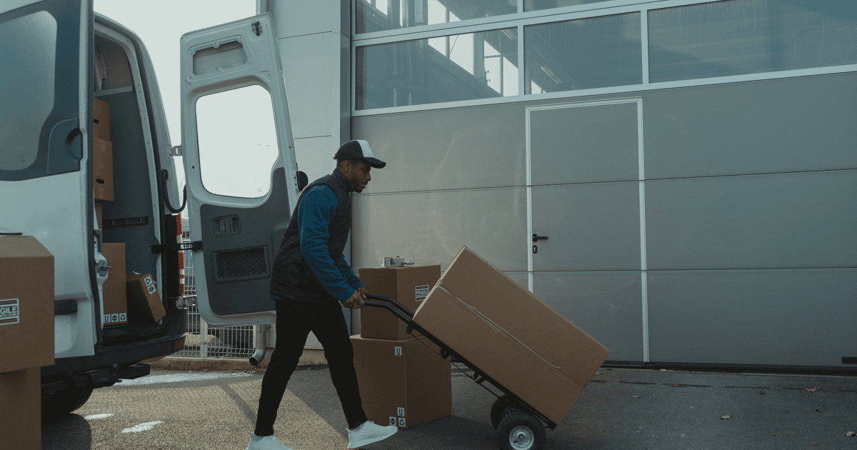 Editorial warehouse photo of inbound cartons racing an earlier Amazon Q4 receiving deadline.